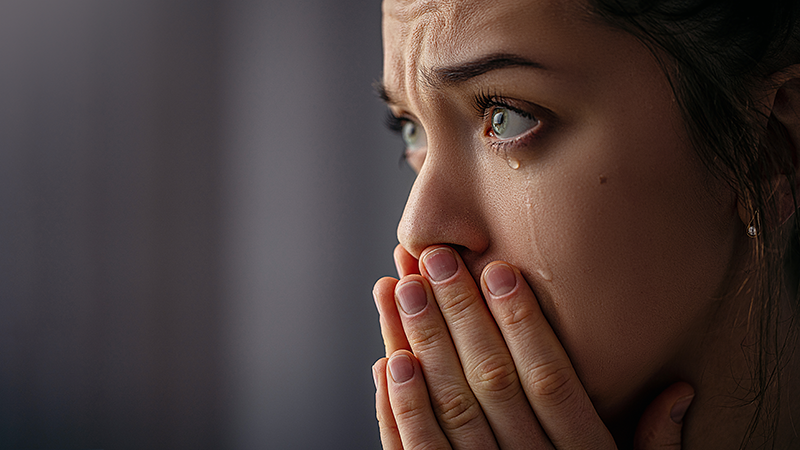 Close up of crying woman with tears in her eyes